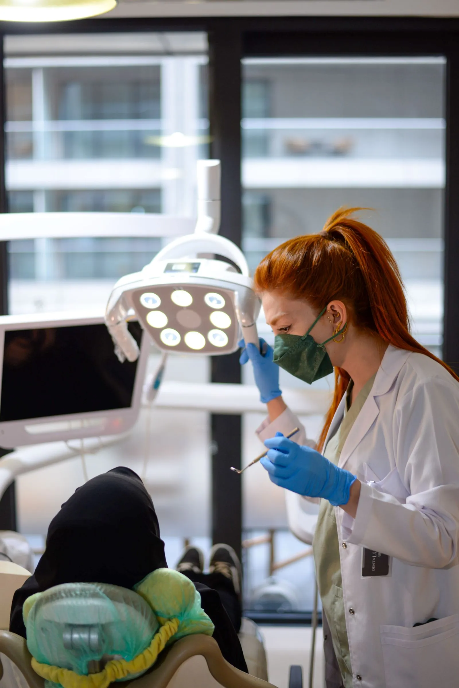 Dentist working under the operating light